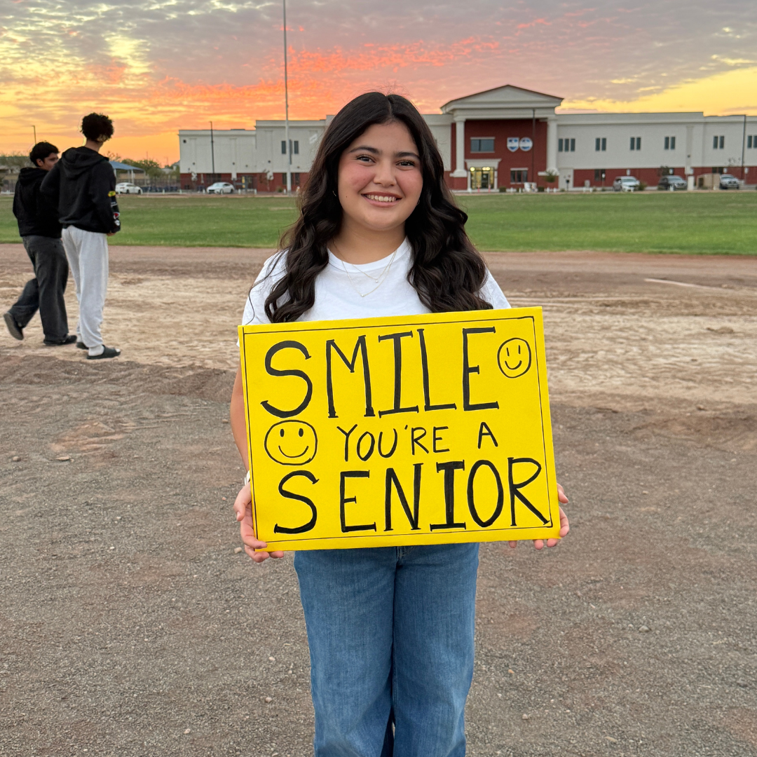 Senior with sign in front of GH Roosevelt