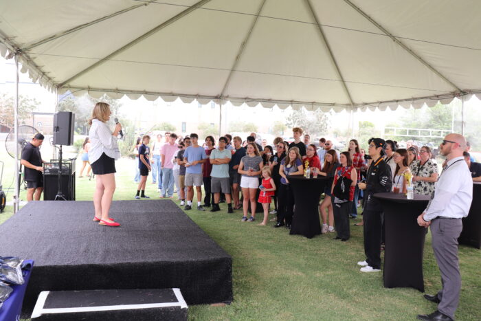 Student speaking to crowd