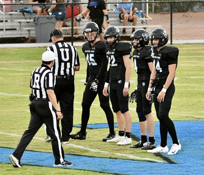 Veritas Prep football players on field