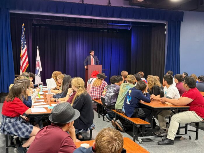 Civics Day speaker with audience of students