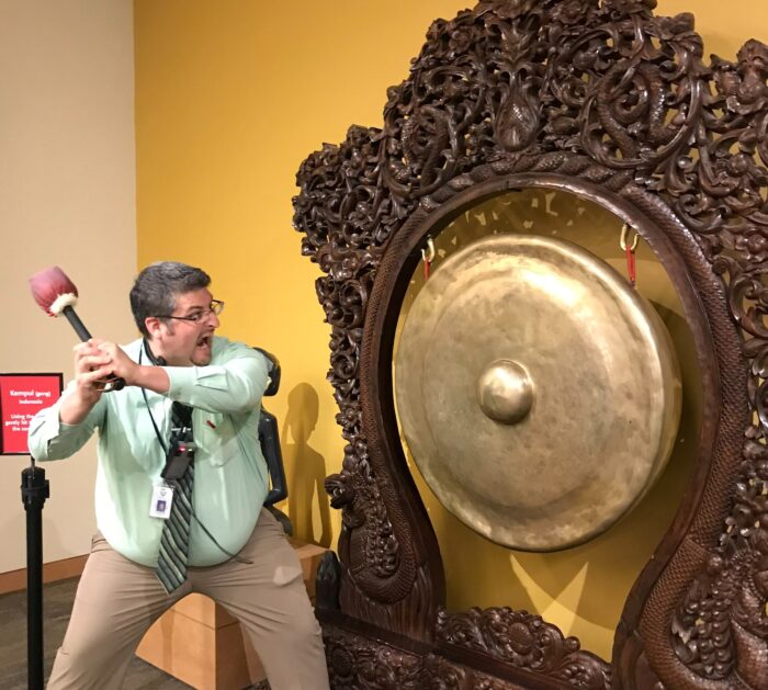 Rodriguez with a large gong