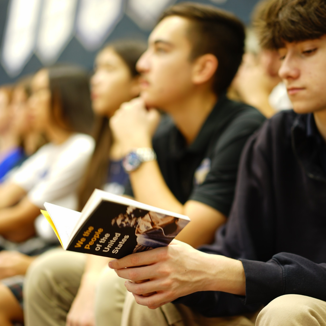 Scottsdale students in audience with booklet