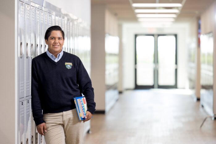 Student leaning against a locker
