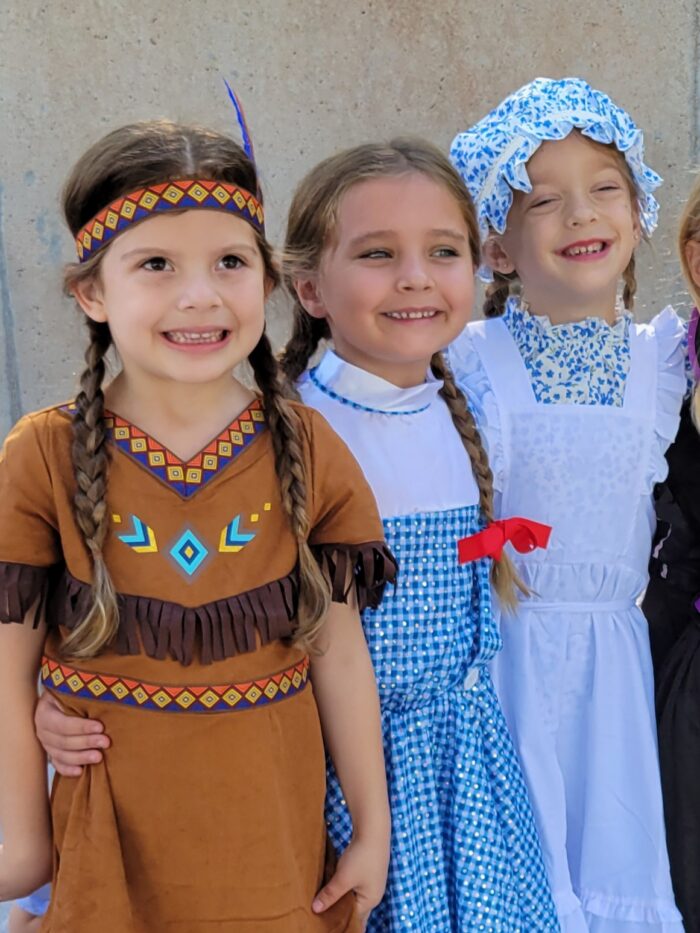 3 students dressed like literary characters